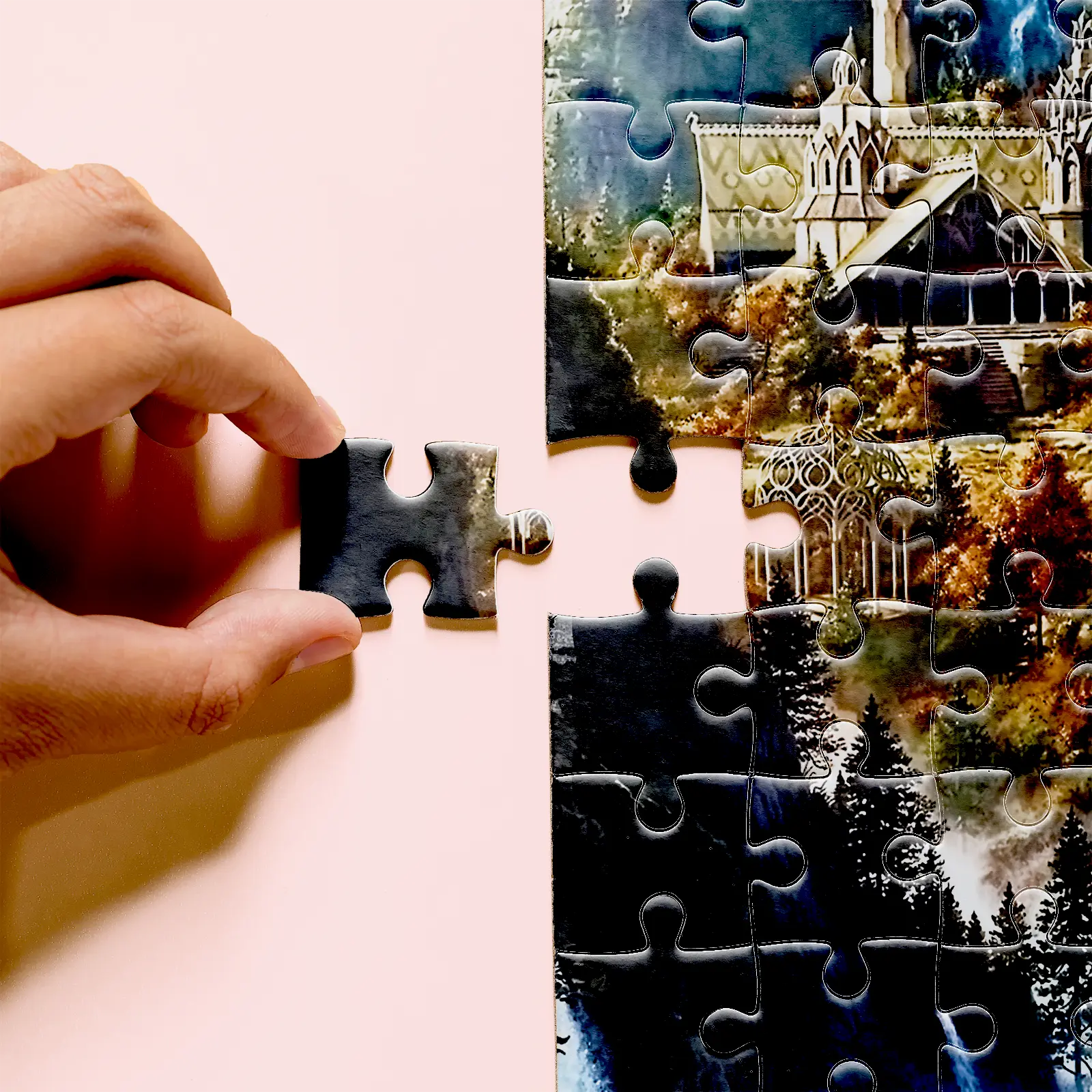 Hand holding a Rivendell puzzle piece beside ornate buildings and autumn foliage